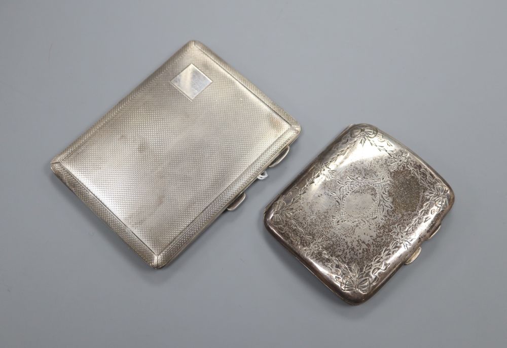 An engine turned silver cigarette case and a smaller case with engraved decoration, 6oz.